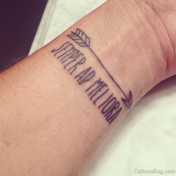Arrow With Quote Tattoo On Wrist