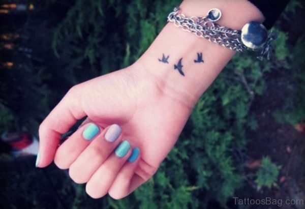 Attractive Black Birds Tattoo