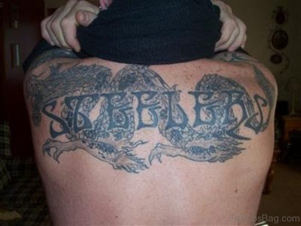 Amazing Old English Tattoo On Upper Back