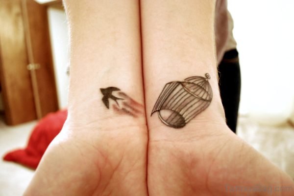 Bird And Cage Tattoo On Wrist