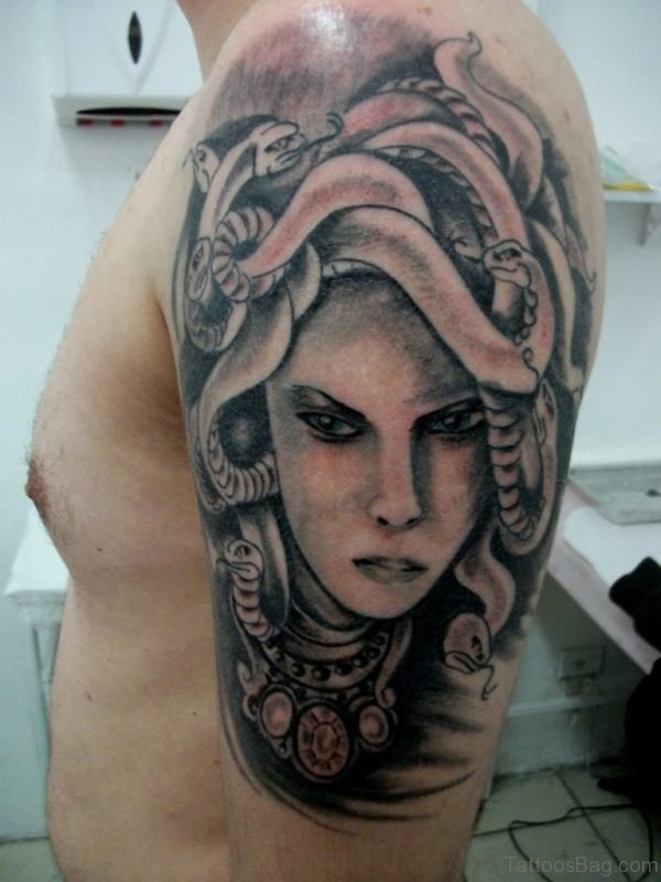 Black And Grey Medusa Tattoo On Man Left Shoulder