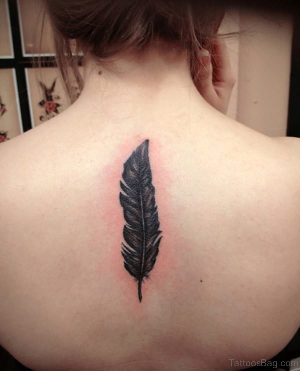 Black Feather Tattoo On Girl Back