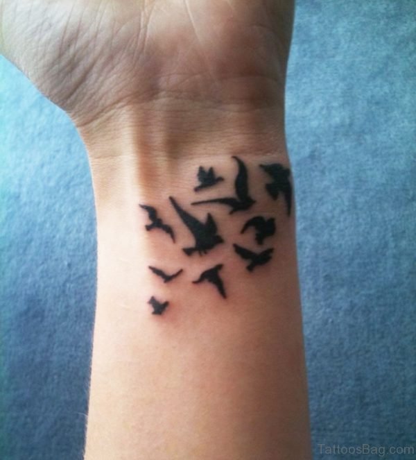 Nice Black Inked Birds Tattoo