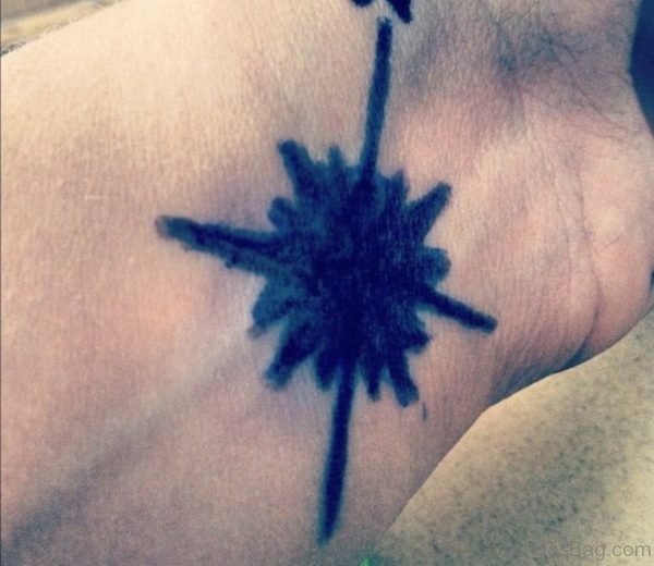 Black Inked Compass Tattoo