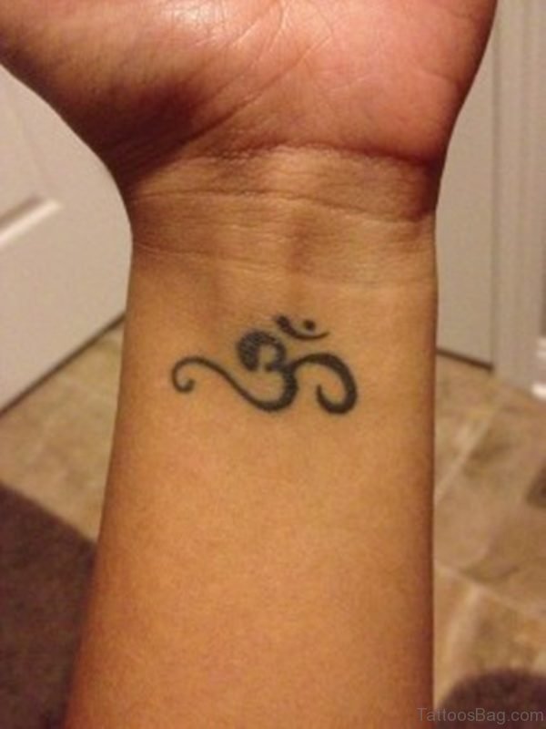 Black Jain Om Tattoo On Wrist