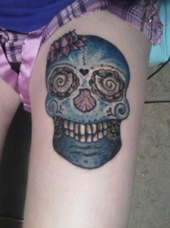 Blue ink Sugar Skull Tattoo On Girl Thigh