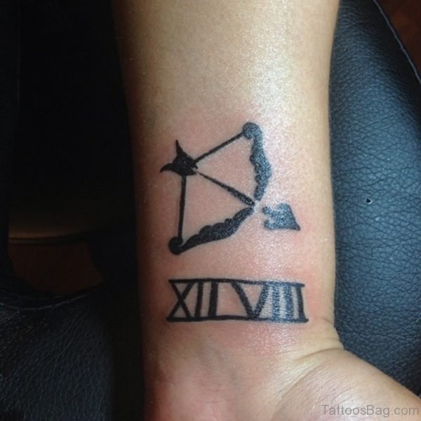 Bow Arrow With Numeric Tattoo On Wrist