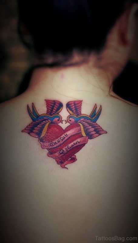 Colored Swallow Heart Tattoo On Back