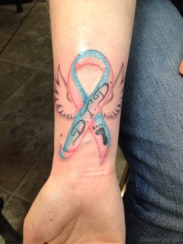 DTD Cancer Ribbon Tattoo On Wrist