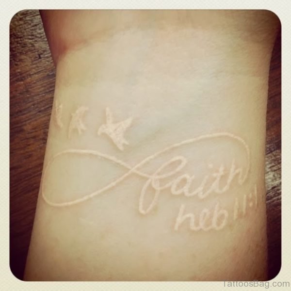 Faith Flying Birds White Ink Tattoo On Wrist
