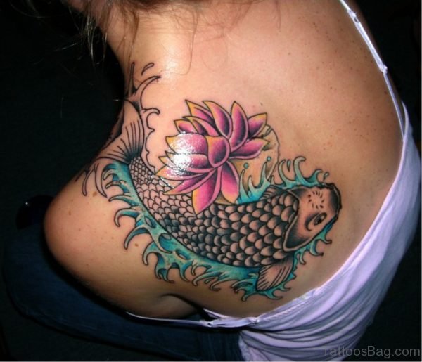 Wonderful Fish And Flower Tattoo On Back