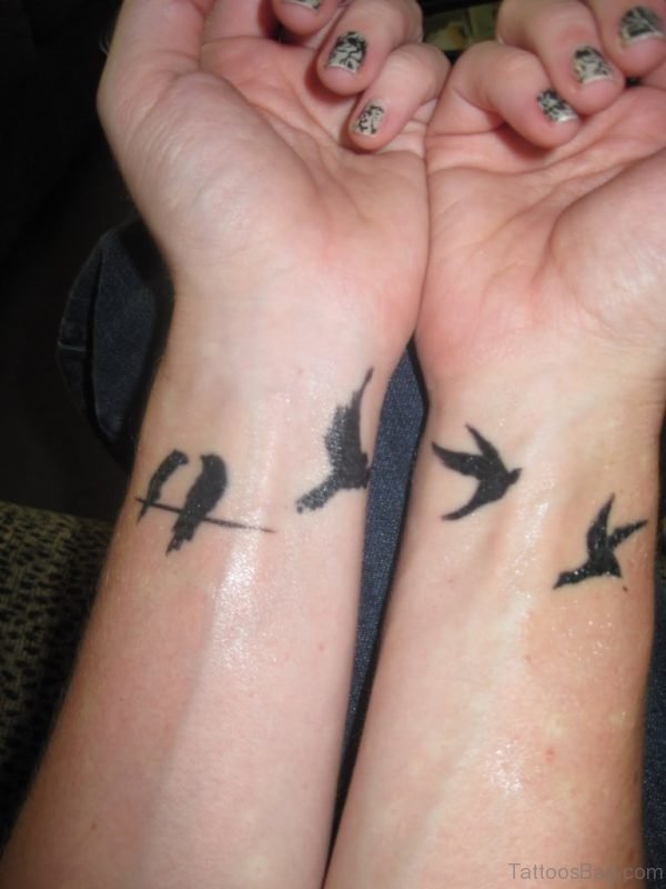 Flying Birds Tattoos On Girl Wrist