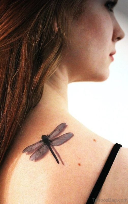 Girl Showing Her  Dragonfly Tattoo