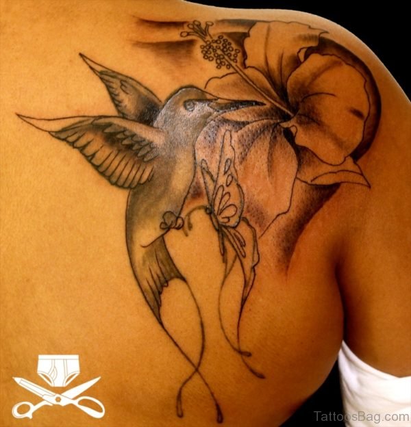 Grey Hummingbird Tattoo On Back