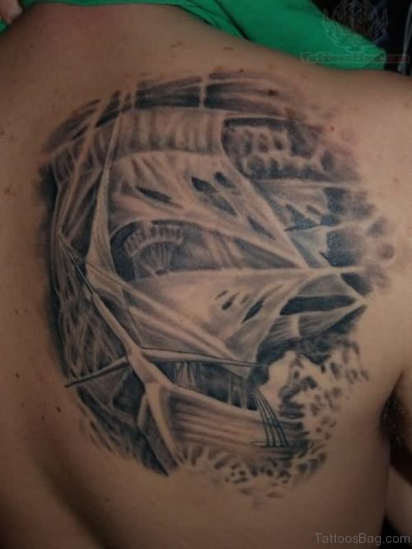 Grey Ink Back Ship Tattoo