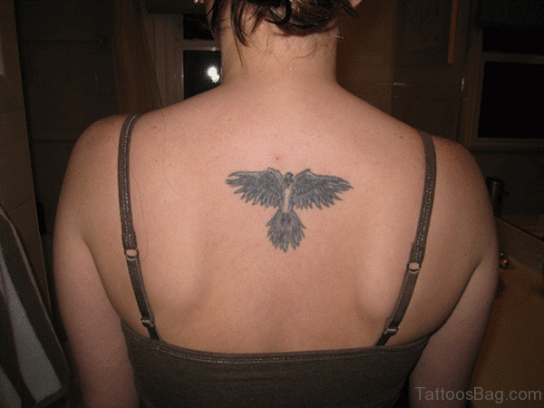 Grey Ink Bird Tattoo On Back