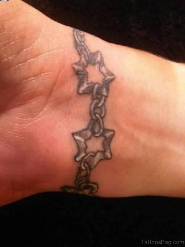Grey Ink Stars Tattoo