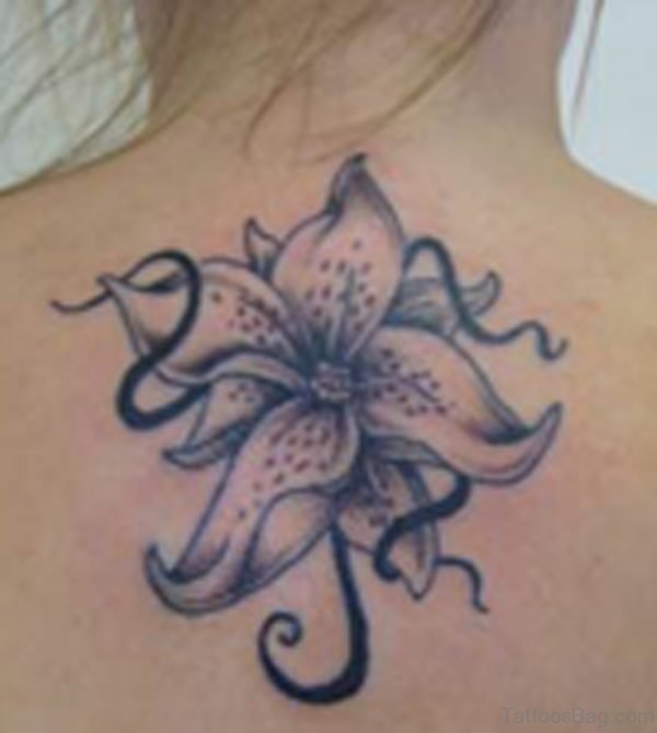 Grey Lily Tattoo On Upper Back