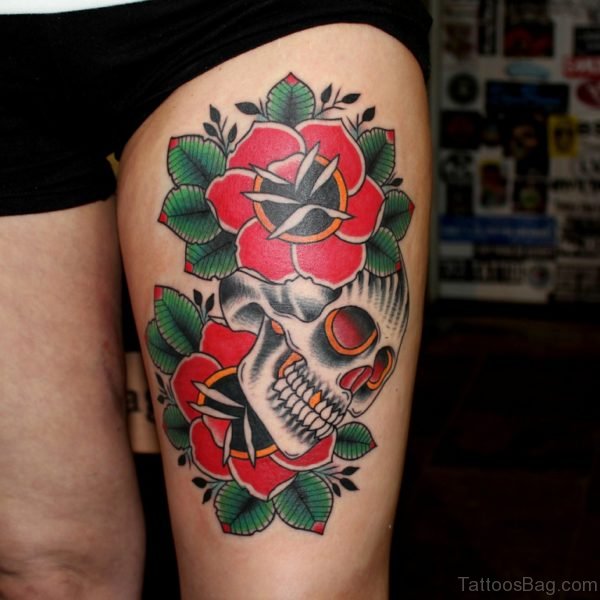 Grey Skull And Red Flowers Thigh Tattoo