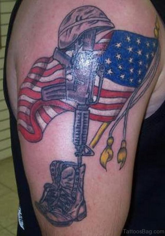 Gun And American Flag Tattoo On Shoulder