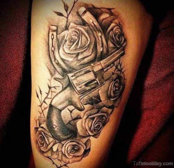 Gun And Rose Tattoo On Thigh