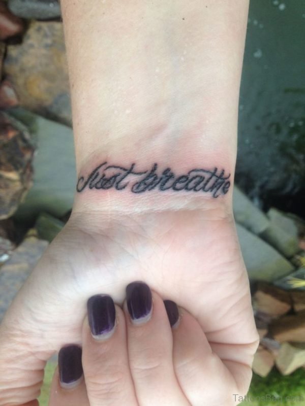 Just Breathe Wording Tattoo On Wrist