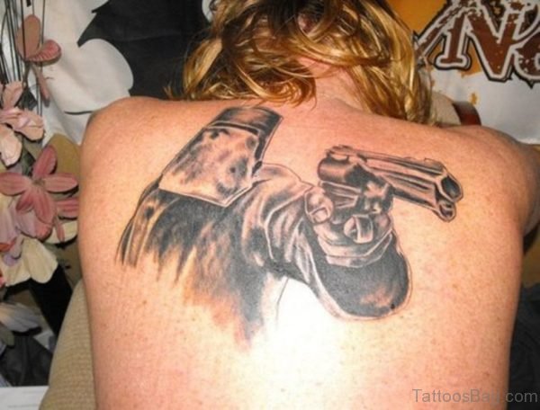 Mask Man With Gun Tattoo On Back