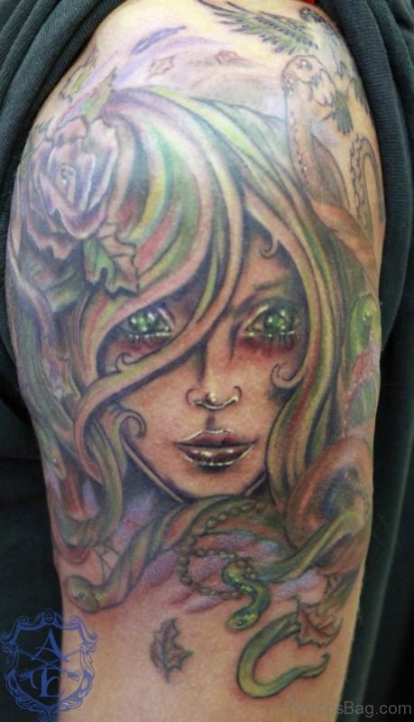Medusa With Green Eyes Tattoo For Shoulder