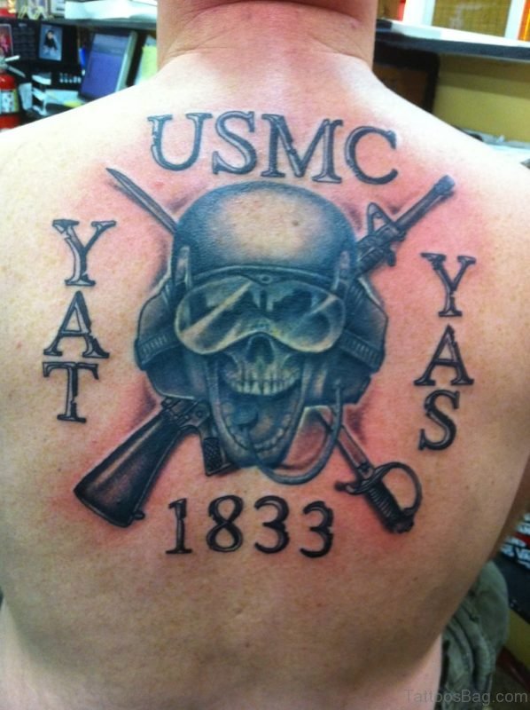 Memorial Marine Skull With Two Crossing Gun Tattoo On Man Upper Back