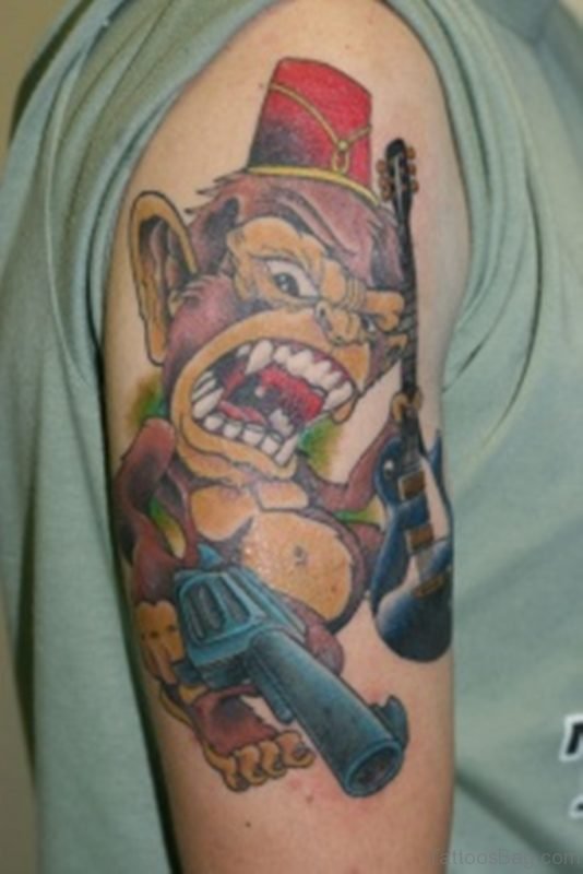 Monkey Holding Gun Tattoo On Shoulder