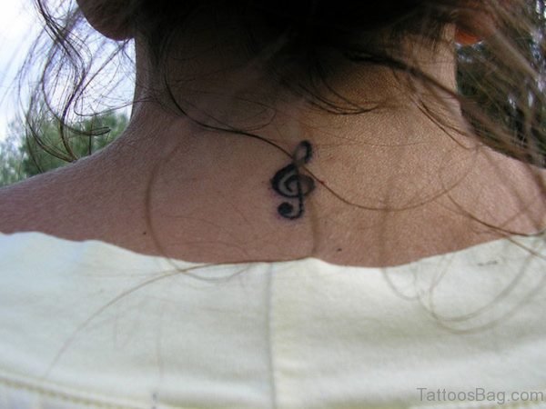 Music Note Tattoo On Upper Back