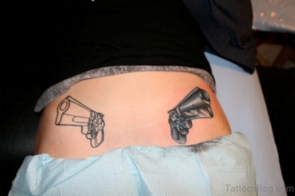 Outstanding Gun Tattoo On Back