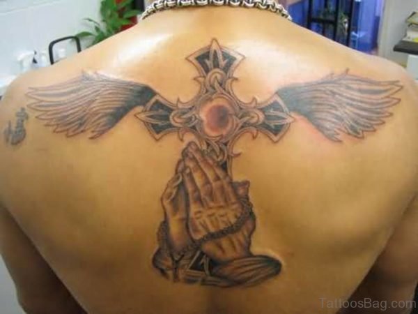 Outstanding Praying Hands And Cross Wings Tattoo