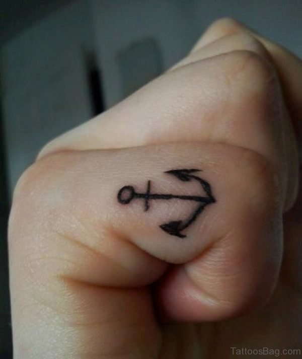 Small Anchor Tattoo On Finger