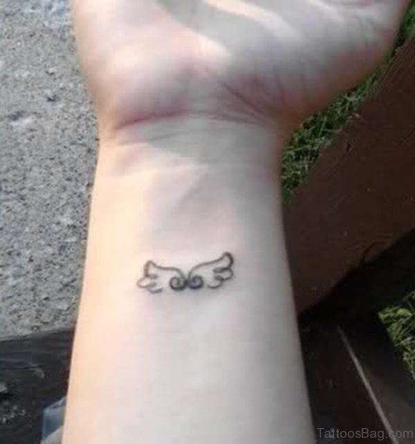 Small Wings Tattoo On Wrist