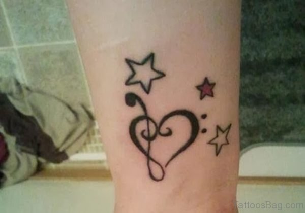 Star And Musical Note Tattoo On Wrist