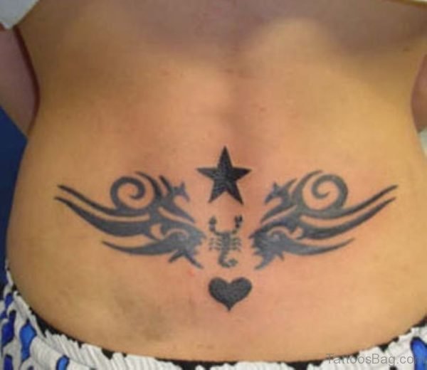 Star And Tribal Tattoo On Lower Back