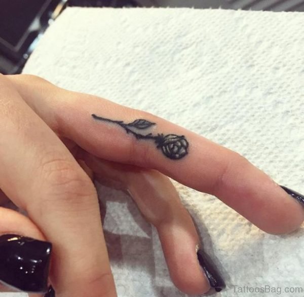 Stunning Rose Tattoo On Middle Finger