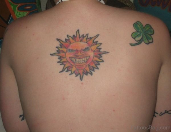 Sun and Clover Leaf Tattoo On Back