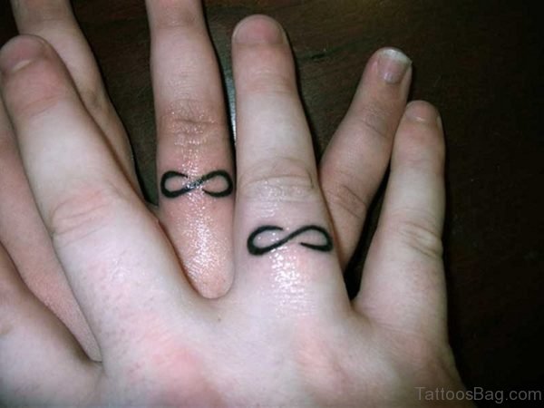 Symbol Tattoo On Finger