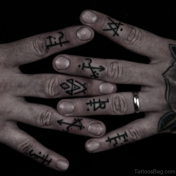 Symbols Tattoo On knuckle