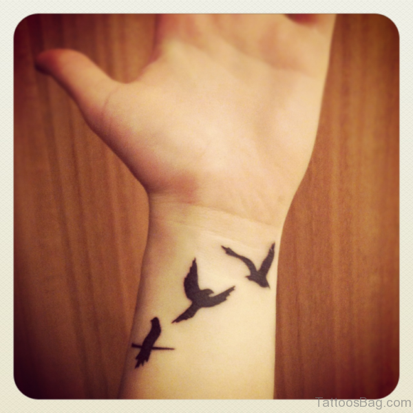Three Flying Birds Tattoo On Wrist