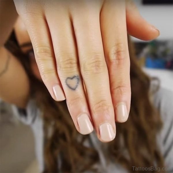 Tiny Heart Tattoo On Finger