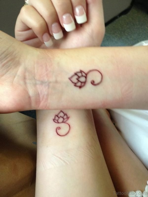 Tiny Lotus Tattoo On Wrist