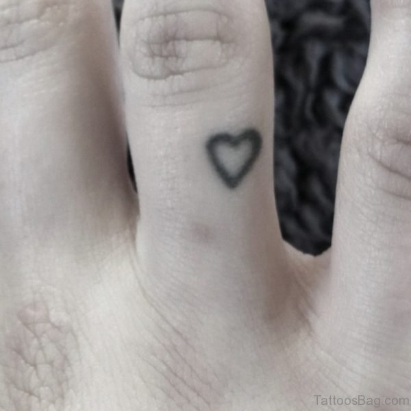 Tiny heart Tattoo On Finger