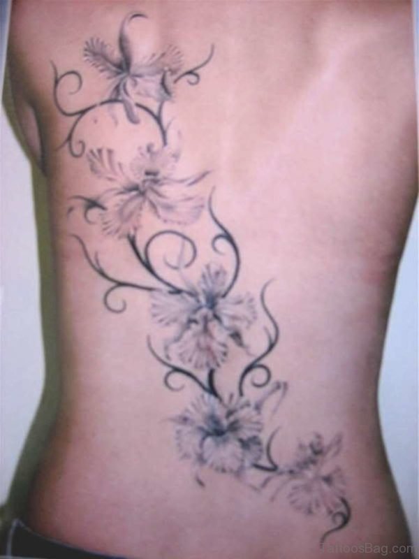 Tribal And Grey Flower Tattoo On Back