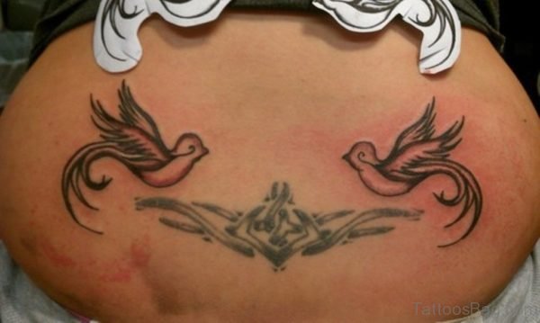 Tribal And Swallow Tattoos on Back