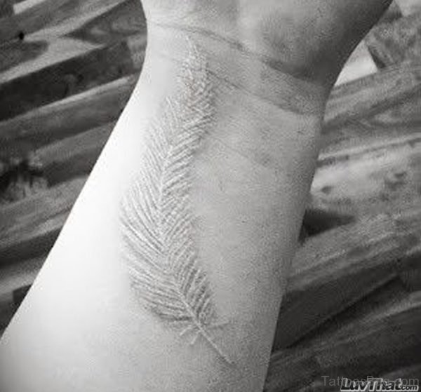 White Ink Feather Tattoo