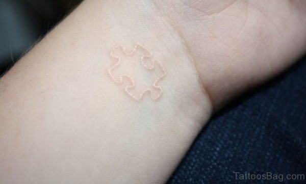 White Ink Wrist Tattoo