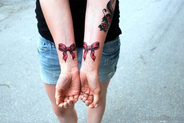 2 Red Bows Tattoos On Both Wrist